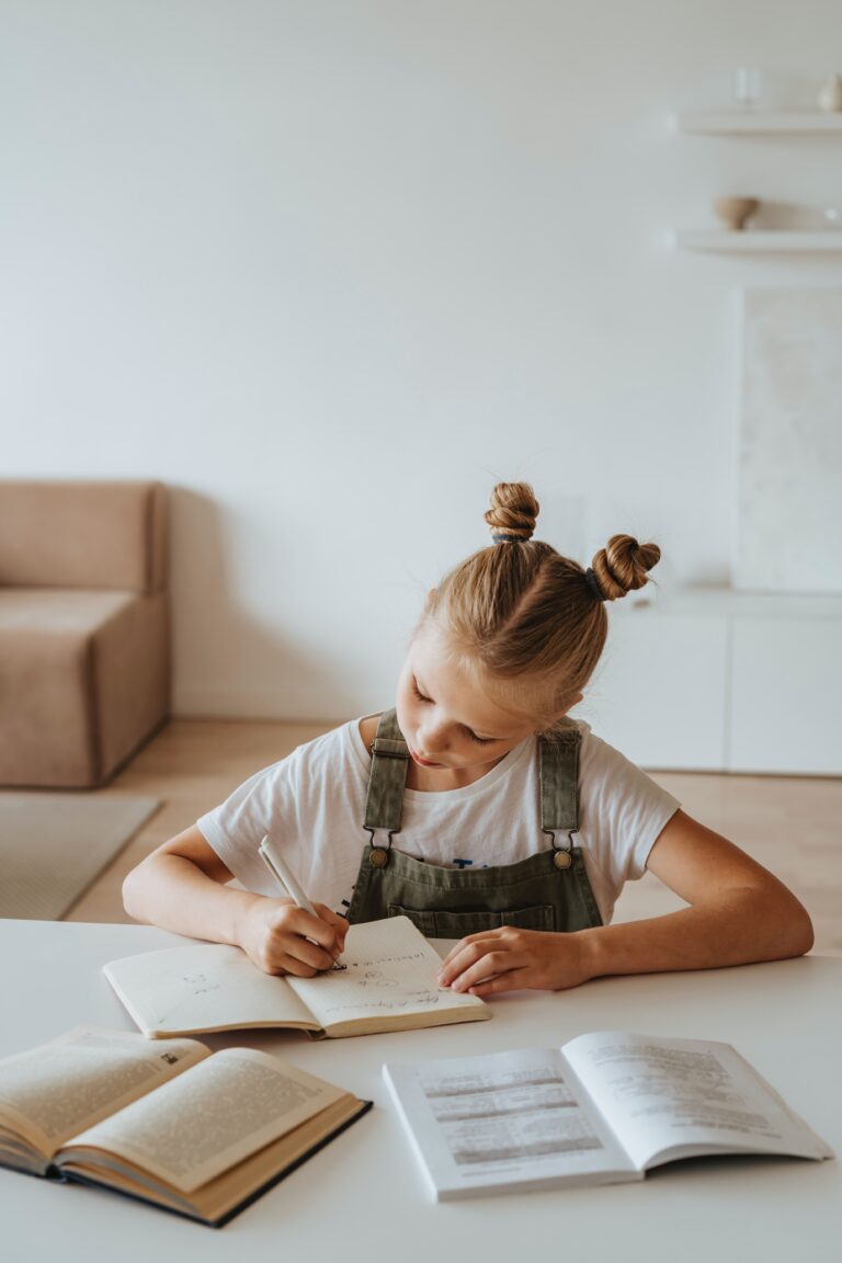 Girl Writing at Table